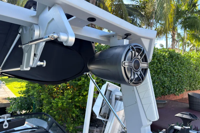 Slide: The Image of 2022 Nautique Super Air Nautique G23 Coastal Edition speaker detail with lush greenery background. - 13