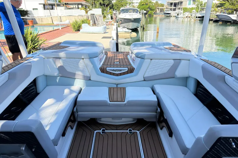 Slide: The Image of 2022 Nautique Super Air Nautique G23 Coastal Edition interior with luxurious seating and elegant design. - 17