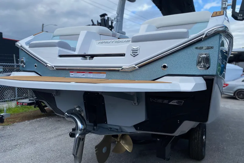 Slide: The Image of 2022 Nautique Super Air Nautique G23 Coastal Edition boat rear view. - 7