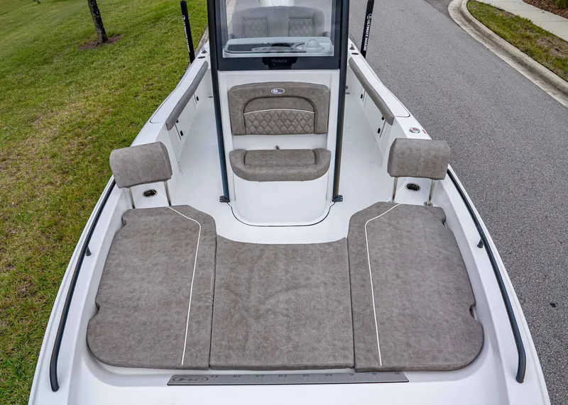 Slide: The Image of 2026 Sea Hunt BX 25 FS boat interior with cushioned seating and spacious deck. - 19