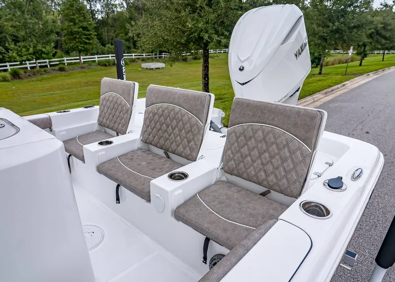 Slide: The Image of 2026 Sea Hunt BX 25 FS boat with cushioned seating and Yamaha outboard motor. - 7