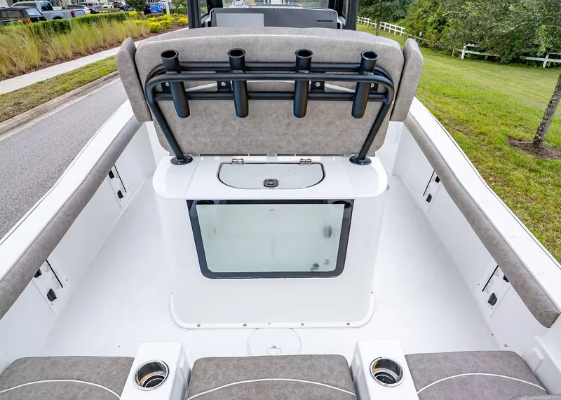 Slide: The Image of 2026 Sea Hunt BX 25 FS boat interior with rod holders and seating. - 9