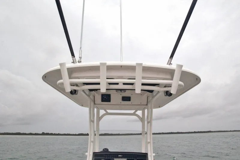 Slide: The Image of 2026 Boston Whaler 230 Outrage helm with Simrad electronics and Mercury controls. - 13