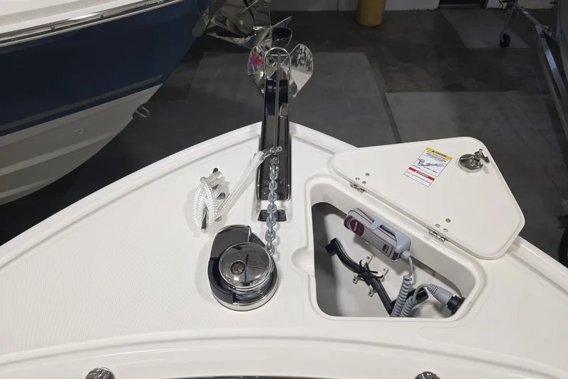 Slide: The Image of Bow of 2026 Boston Whaler 230 Outrage with anchor and storage compartment. - 23