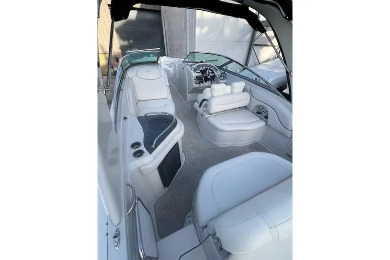 Slide: The Image of 2007 Crownline 320 LS boat interior with white seating and modern dashboard. - 12