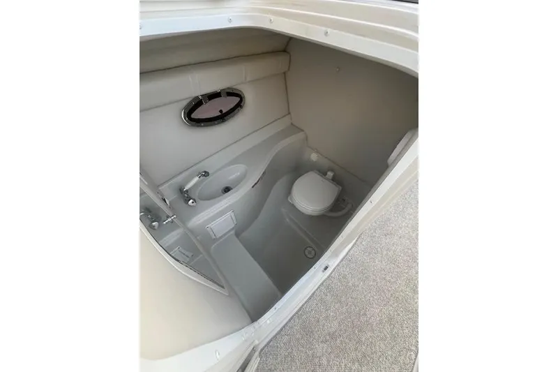 Slide: The Image of 2007 Crownline 320 LS boat interior bathroom with sink and toilet. - 20