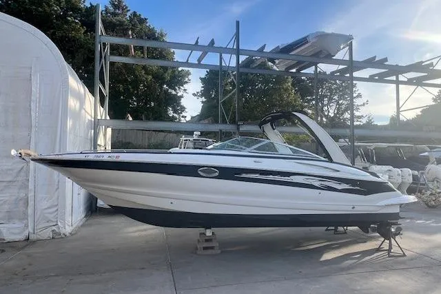 Slide: The Image of 2007 Crownline 320 LS boat on display in outdoor storage area. - 3