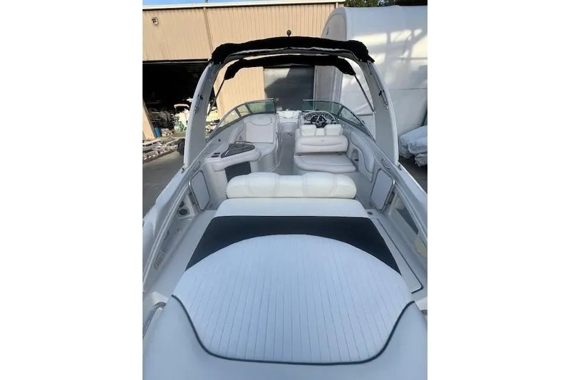 Slide: The Image of 2007 Crownline 320 LS boat interior with white seating and sleek design. - 7