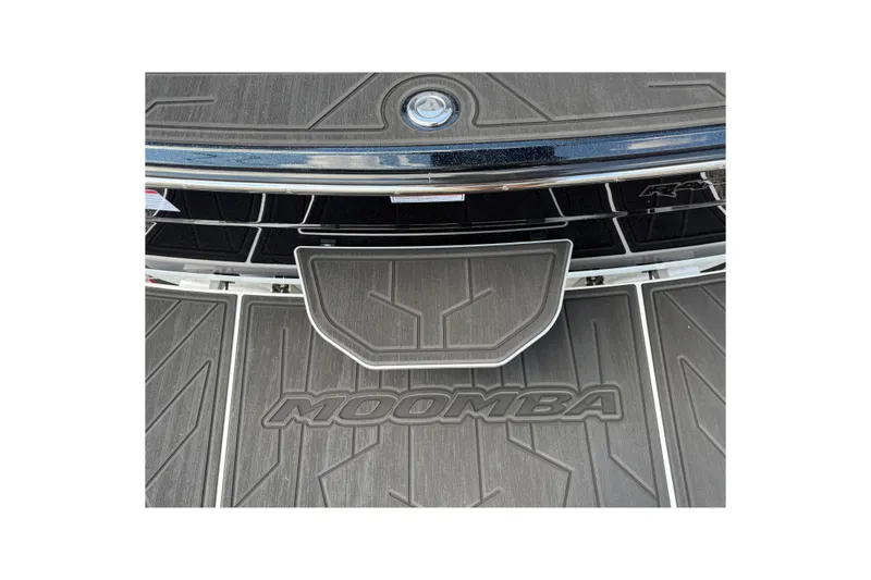 Slide: The Image of 2026 Moomba Tykon boat deck with logo and textured surface. - 11