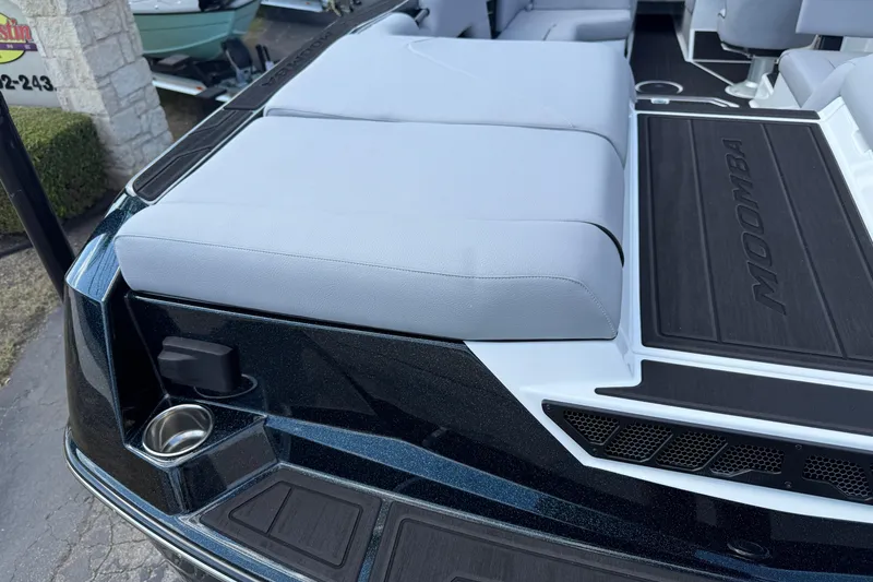 Slide: The Image of 2026 Moomba Tykon boat interior with cushioned seating and sleek design. - 12