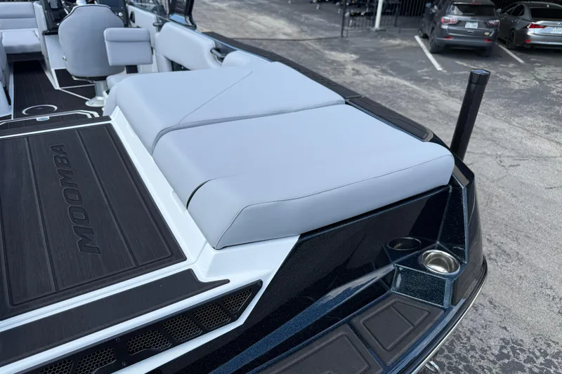 Slide: The Image of 2026 Moomba Tykon boat interior with cushioned seating and sleek design. - 13