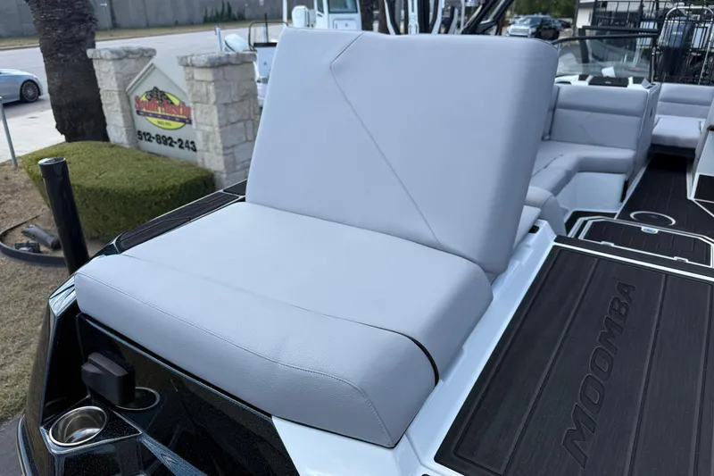 Slide: The Image of 2026 Moomba Tykon boat with sleek seating and modern design. - 14