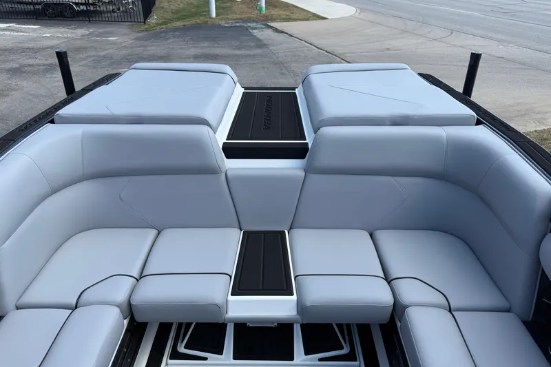 Slide: The Image of 2026 Moomba Tykon boat interior with sleek gray seating and modern design. - 17