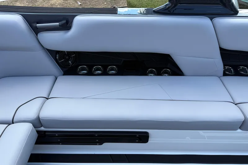 Slide: The Image of 2026 Moomba Tykon interior with sleek, modern seating and integrated cup holders. - 22