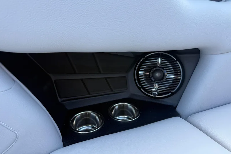 Slide: The Image of 2026 Moomba Tykon interior detail with speaker and cup holders. - 28