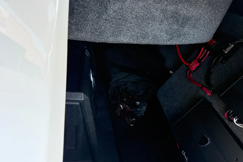 Slide: The Image of Interior view of 2026 Moomba Tykon, featuring wiring and storage compartment. - 45