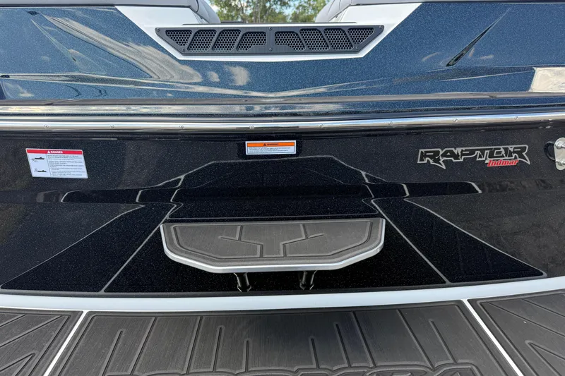 Slide: The Image of 2026 Moomba Tykon boat rear view with Raptor Indmar engine branding. - 8