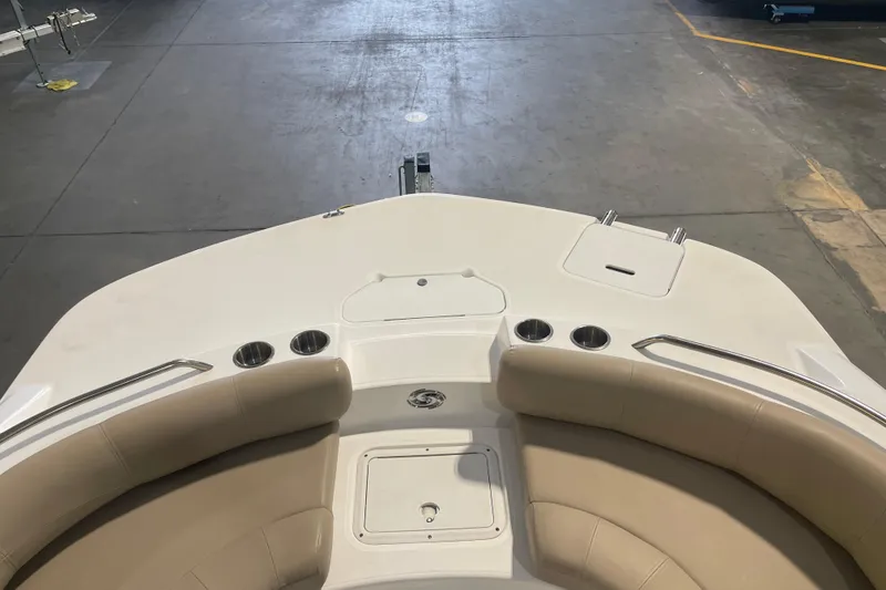 Slide: The Image of 2023 Hurricane SunDeck Sport 201 OB boat interior with seating and cup holders. - 16