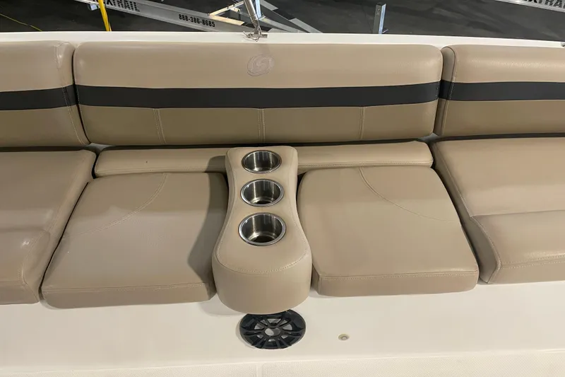 Slide: The Image of 2023 Hurricane SunDeck Sport 201 OB boat seating with cup holders and beige upholstery. - 19