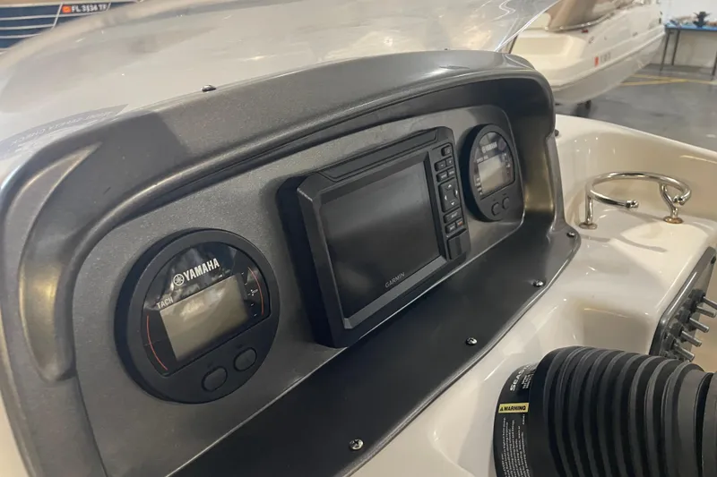 Slide: The Image of Dashboard of 2023 Hurricane SunDeck Sport 201 OB with Yamaha and Garmin displays. - 24