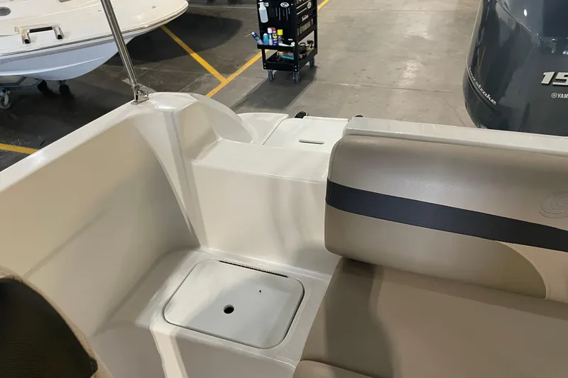 Slide: The Image of 2023 Hurricane SunDeck Sport 201 OB boat interior with seating and storage area. - 28
