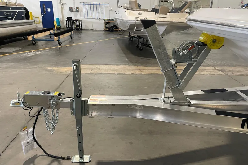 Slide: The Image of 2023 Hurricane SunDeck Sport 201 OB boat trailer in a showroom setting. - 30