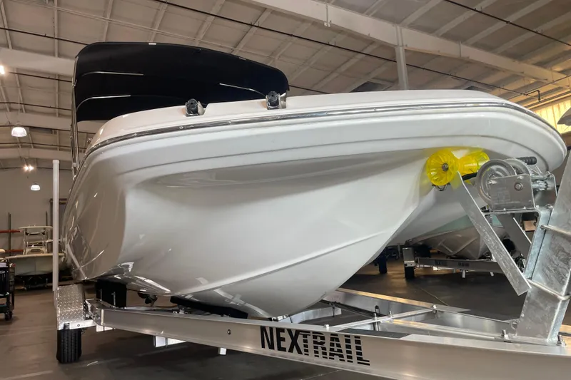 Slide: The Image of 2023 Hurricane SunDeck Sport 201 OB boat on trailer in indoor showroom. - 7