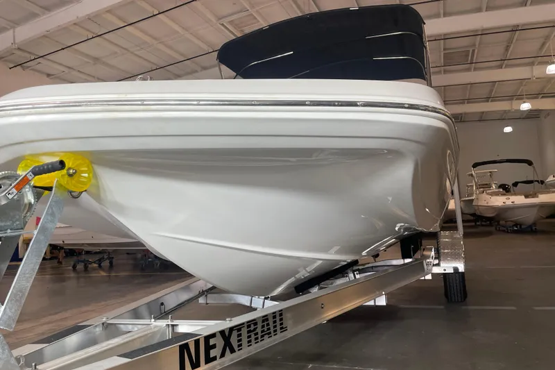 Slide: The Image of 2023 Hurricane SunDeck Sport 201 OB boat on trailer in indoor showroom. - 8