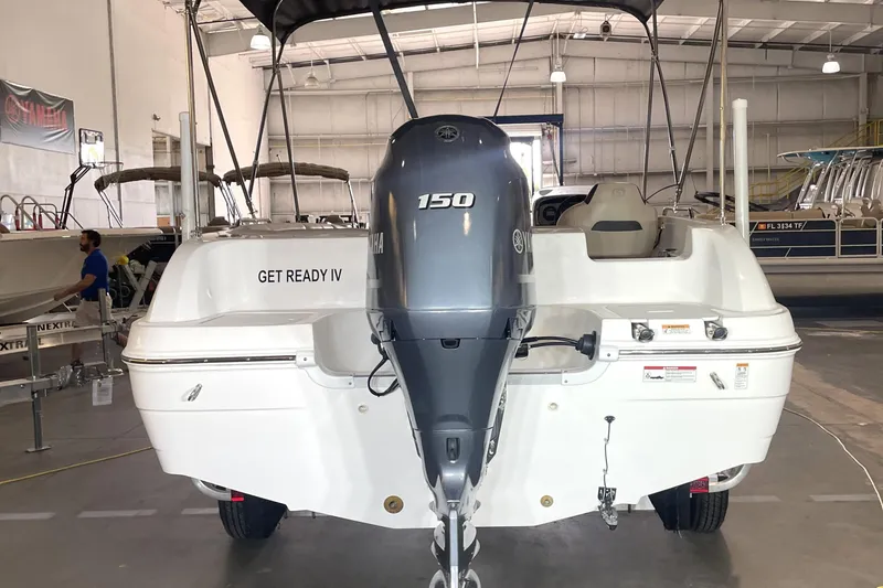 Slide: The Image of 2023 Hurricane SunDeck Sport 201 OB boat with Yamaha 150 engine in showroom. - 9