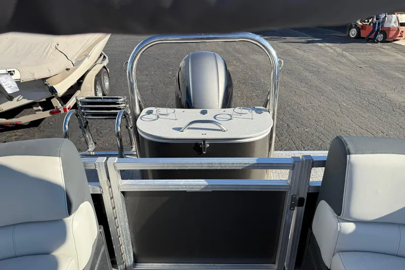 Slide: The Image of 2025 Avalon 2585 LSZ QL pontoon boat interior with seating and motor view. - 4