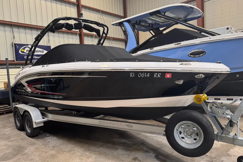 The Image of 2023 Chaparral 21 SSi OB boat on trailer in indoor storage facility. - 0