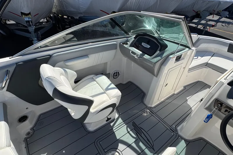 Slide: The Image of 2023 Chaparral 21 SSi OB boat interior with sleek seating and modern dashboard design. - 10