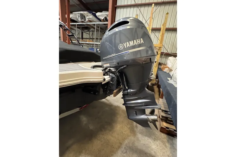 Slide: The Image of 2023 Chaparral 21 SSi OB with Yamaha outboard motor in storage. - 17