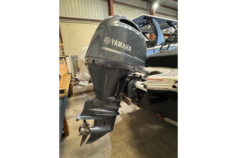 Slide: The Image of 2023 Chaparral 21 SSi OB with Yamaha outboard motor in storage. - 18