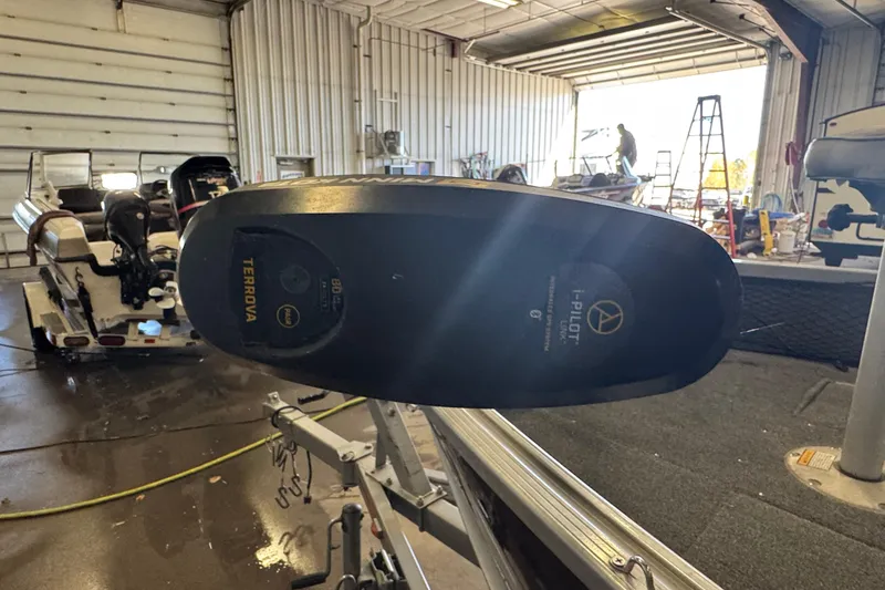 Slide: The Image of 2013 Alumacraft Competitor 165 Sport in garage with Terrova trolling motor. - 12