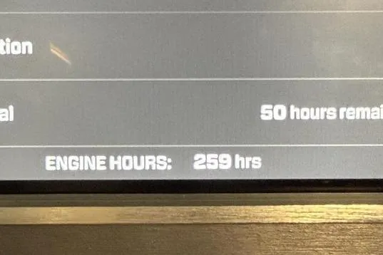 Slide: The Image of 2023 MasterCraft XT23 display showing 259 engine hours and 50 hours remaining. - 7