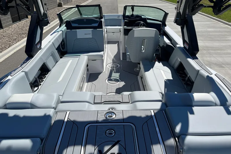 Slide: The Image of 2025 MasterCraft X22 boat interior with sleek seating and modern design. - 10