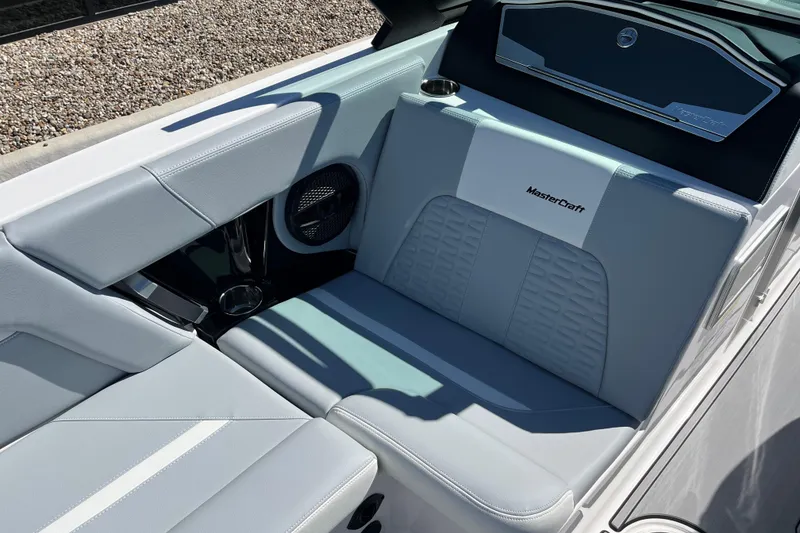 Slide: The Image of 2025 MasterCraft X22 boat interior with sleek, modern seating and premium finishes. - 12
