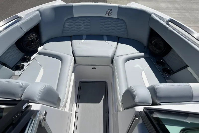 Slide: The Image of Luxurious interior of 2025 MasterCraft X22 boat with plush seating and cup holders. - 13