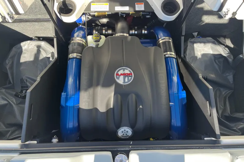 Slide: The Image of 2025 MasterCraft X22 engine compartment with Ilmor engine, showcasing blue and black components. - 15