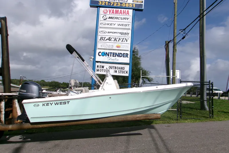 The Image of 2026 Key West 179 FS boat displayed outdoors near dealership sign. - 1