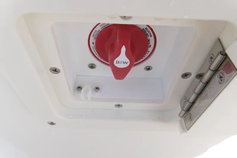 Slide: The Image of Red switch on 2026 Key West 179 FS boat, mounted in a white compartment. - 11