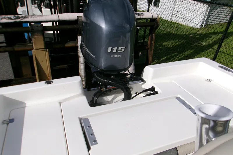 Slide: The Image of 2026 Key West 179 FS boat with Yamaha 115 outboard motor, docked outdoors. - 12