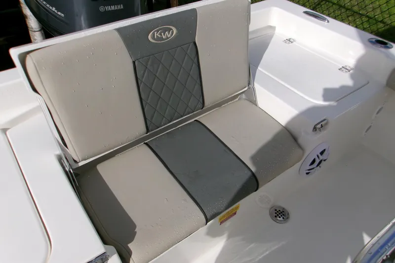 Slide: The Image of 2026 Key West 179 FS boat seat with gray and beige upholstery, featuring KW logo. - 13