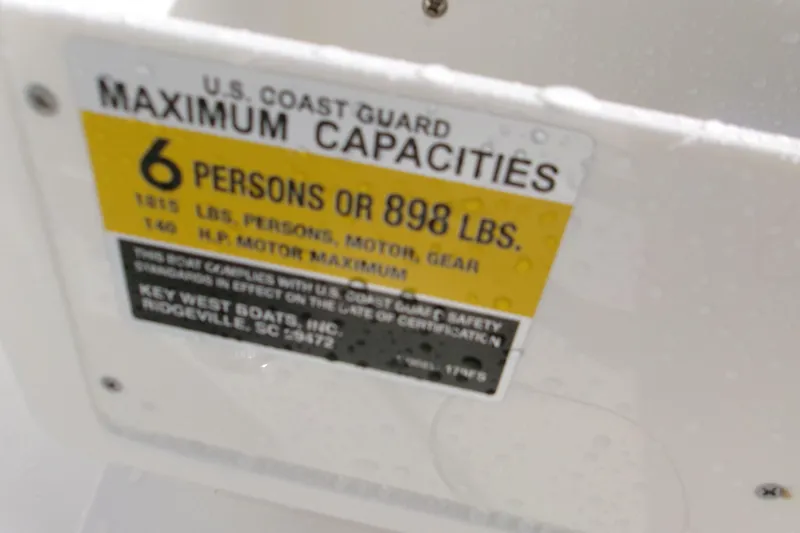 Slide: The Image of Key West 179 FS 2026 boat capacity label, 6 persons or 898 lbs maximum. - 16