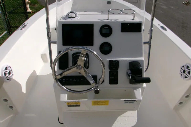 Slide: The Image of 2026 Key West 179 FS boat console with steering wheel and gauges. - 6