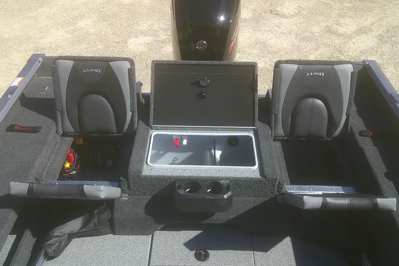 Slide: The Image of 2026 Lund 1775 Impact XS Sport boat interior with seating and storage compartments. - 12