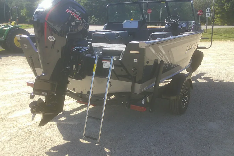 Slide: The Image of 2026 Lund 1775 Impact XS Sport boat with Mercury Pro XS engine and ladder. - 13