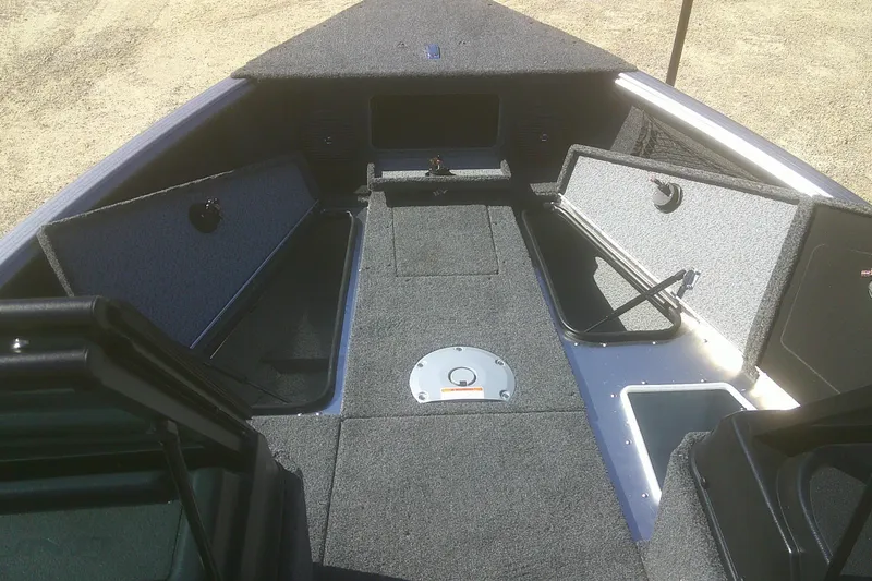 Slide: The Image of 2026 Lund 1775 Impact XS Sport boat interior with open storage compartments. - 6