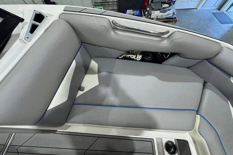 Slide: The Image of 2020 Moomba Makai boat interior with gray seating and blue accents. - 16